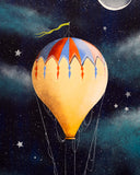 Colorful hot air balloon against a starry night sky