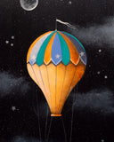 Colorful hot air balloon against a starry night sky