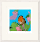 Framed artwork of a robin bird on pink flowers with a blue background
