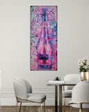 Abstract painting in a modern interior setting with chairs and a table.
