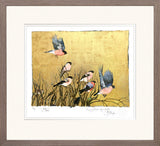 Framed artwork of birds on a gold background