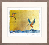 Framed artwork of two birds over water with a yellow background