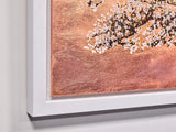 Framed artwork with cherry blossom design on a textured background