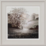 Framed artwork of a landscape with a tree and person walking in the distance.
