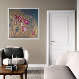 Living room with a floral painting on the wall, gray armchair, and wooden coffee table.