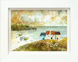 Framed artwork of a coastal scene with houses and boats.