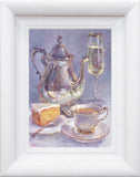 Framed artwork of a still life with a teapot, cup, saucer, cake, and champagne glass.