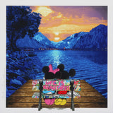 Two cartoon characters sitting on a bench by a lake with mountains at sunset.