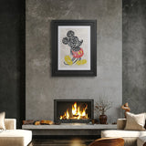 Framed artwork above a fireplace in a modern living room.