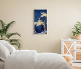 A vertical framed painting of a night scene with a deep blue sky