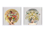 Two framed square art prints side by side, each showing a stylized portrait of a woman with a large floral headpiece. The left print has a gold circular background with multicolored flowers, and the right print has a gray circular background with white and yellow flowers.