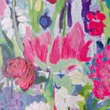 Colorful floral pattern with pink, green, and purple flowers.