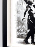 Framed artwork with a silhouette of a person and text 'LOVE IS THE ANSWER' on a textured background.