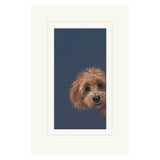 Framed artwork of a dog's face on a blue background