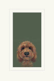 A framed portrait print of a fluffy brown dog on a muted dark green background