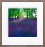 Framed artwork of a forest with purple flowers and green trees.