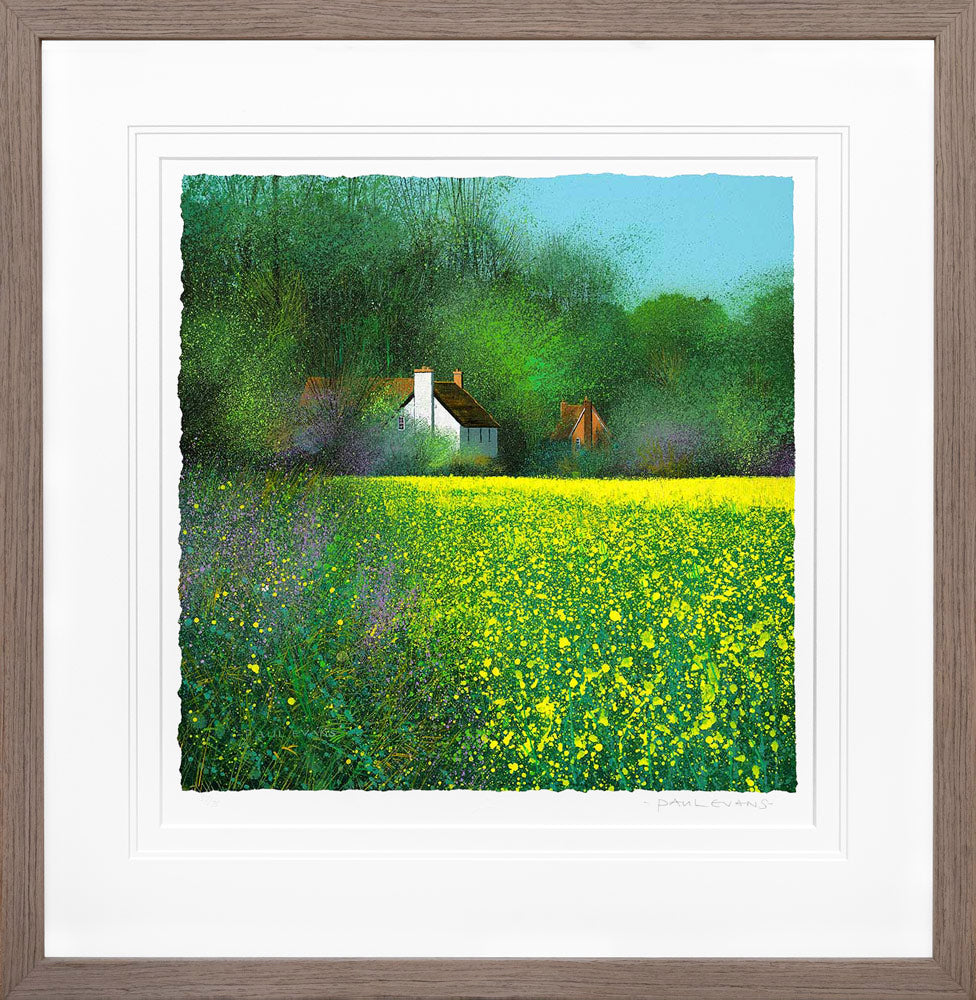 Framed artwork of a house in a field with yellow flowers and green trees.