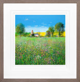 Framed artwork of a field with wildflowers, trees, and a beehive.