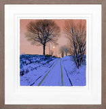 Framed artwork of a snowy landscape with bare trees and a pink sky.