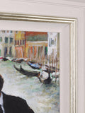 Framed painting of a canal scene with gondolas and buildings.
