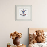 framed illustrated character in a blue dress with arms outstretched, surrounded by books on a plain wall over a children's bed and side table