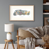 Living room with a framed print on the wall, a sofa with cushions, and a lamp.