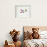 framed illustration of two characters floating in the air surrounded by chocolate sweets on a plain wall above a children's bed and side table