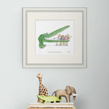 framed artwork of illustrated crocodile with children on a white background, featuring text from Roald Dahl on a wall above animal toys