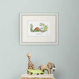 framed illustration on light green wall