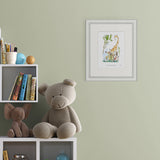 framed illustration of man surrounded by a giraffe, pelican, monkey and boy next to a tall tree on a wall next to shelves of books and toys.