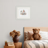 Framed artwork above a bed with a teddy bear and decorative items on a nightstand.