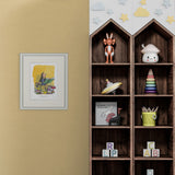 Wooden shelf with toys and a framed picture on a beige wall.