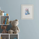 framed illustration of l giant man sitting on top of a large rock talking to a small child on light blue wall next to shelves of books and toys.