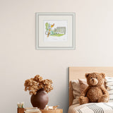 framed illustration of a giraffe and a monkey with a castle in the background, featuring Roald Dahl's work on a wall above childrens bed