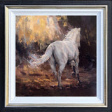 oil painting of white horse walking away surrounded by golden light in black and gold frame