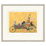 Framed artwork of a person riding a bicycle with animals on a yellow background