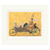 Mounted artwork of a person riding a bicycle with dogs on a yellow background