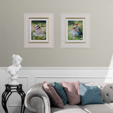 Living room with framed pictures on the wall, a sofa with cushions, and a small statue.