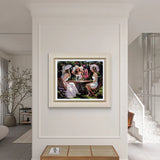 Framed painting of a group of women at a table on a wall in a modern interior setting.