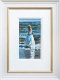 Framed painting of a woman in a white dress standing in water.