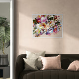 Floral artwork on a wall above a sofa with decorative pillows