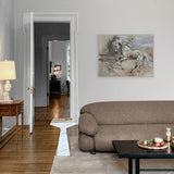Living room with a brown sofa, coffee table, and horse painting on the wall.