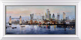 Framed artwork of a city skyline with prominent buildings, including a clock tower, on a body of water.