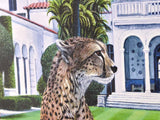 Cheetah in front of a luxurious mansion with palm trees