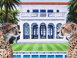 Two cheetahs in front of a luxurious mansion with a pool.