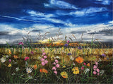 summer meadow of yellow, pink and orange florals against blue sky.