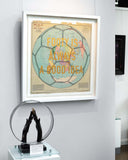 Framed map of the world with text 'Footy is always a good idea' on a wall.
