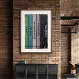 Framed artwork on a brick wall with text on colorful blocks