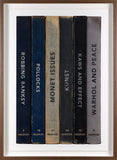 Framed artwork of books with titles on a white background