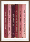 Framed artwork of set of six wine-themed book spines with humorous titles on a white background